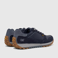 Pair of Cat Men's Trigen P726925 Total Eclipse shoes, dark blue and gray with brown soles, shown from a rear-quarter view.