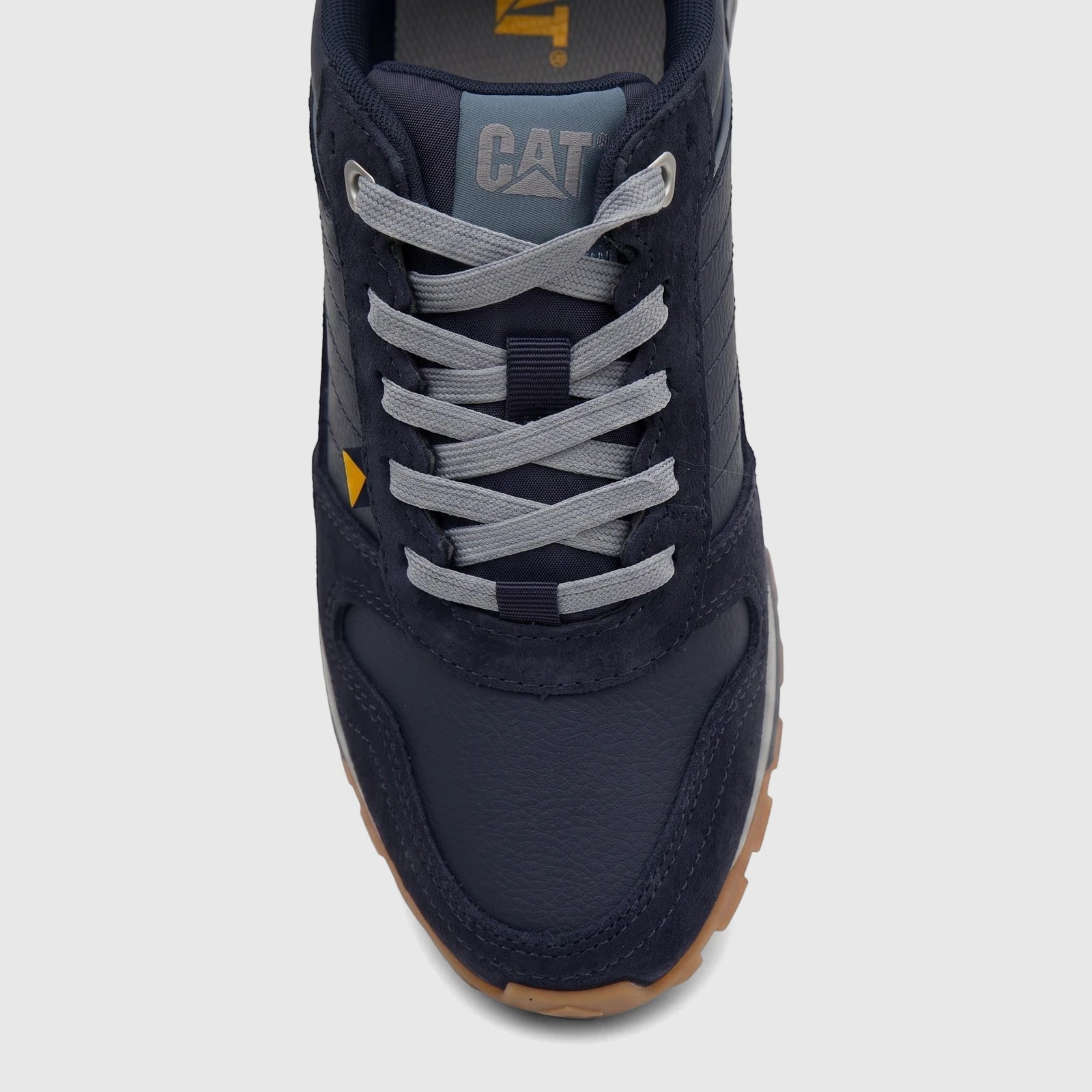 Cat Men's Trigen P726925 Total Eclipse CT403 sneaker in navy blue with grey laces and a brown sole, detailed close-up shot.