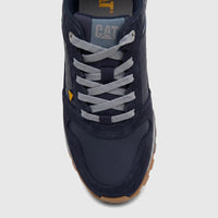 Cat Men's Trigen P726925 Total Eclipse CT403 sneaker in navy blue with grey laces and a brown sole, detailed close-up shot.
