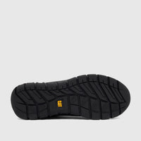 Bottom view of a black Cat Men's Versage Slip On shoe, showcasing its durable rubber sole with distinctive tread pattern and