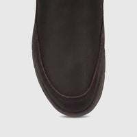 Close-up of a men's Cat Versage slip-on shoe in coffee bean brown leather, showing the toe box and stitching detail.