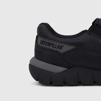Cat Men's Versage Slip On P727014 shoe in black, featuring a visible Caterpillar logo on the side and a textured sole.
