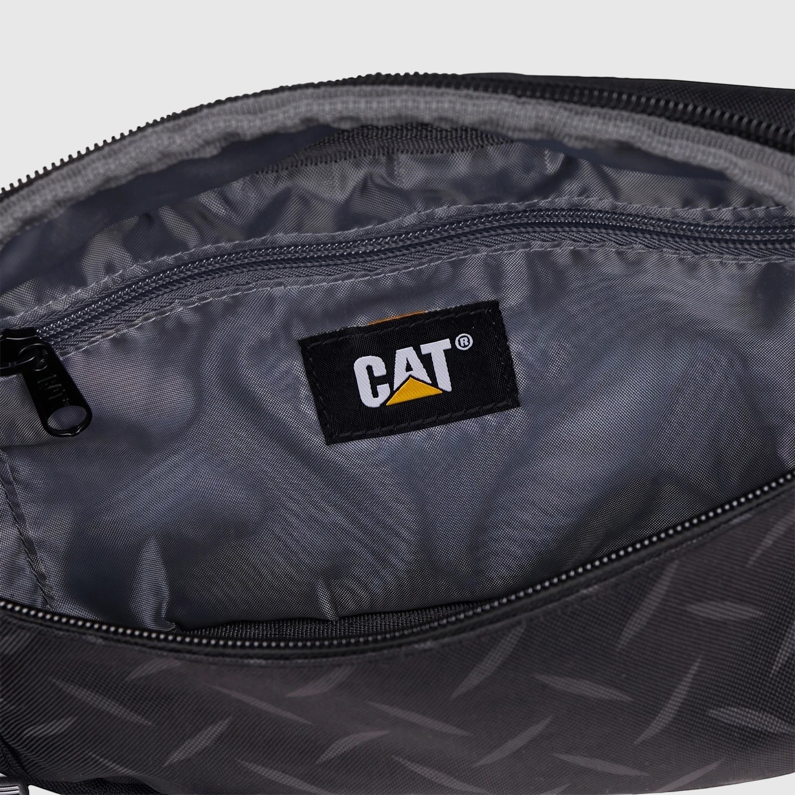 Black Cat Voyager 2 in 1 Daypack showing the open main compartment interior with the yellow CAT logo label.