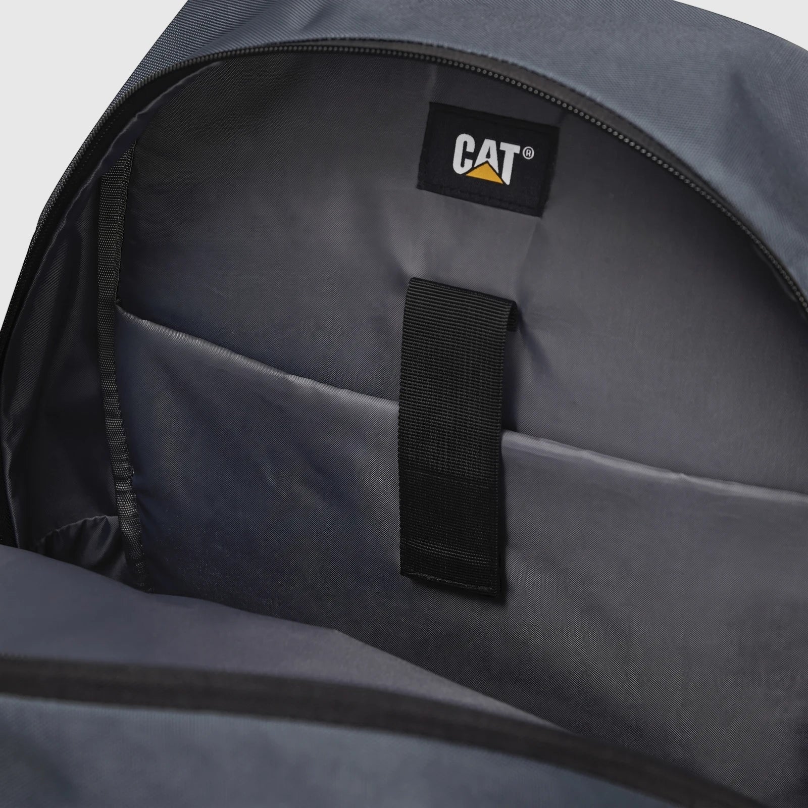 Close-up interior view of a gray Cat Voyager backpack, model 84960-106, showing the main compartment with a laptop sleeve