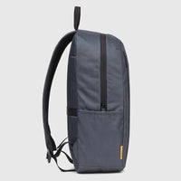 Charcoal gray Cat Voyager Backpack, shown from a side view, featuring a modern design and durable material with visible