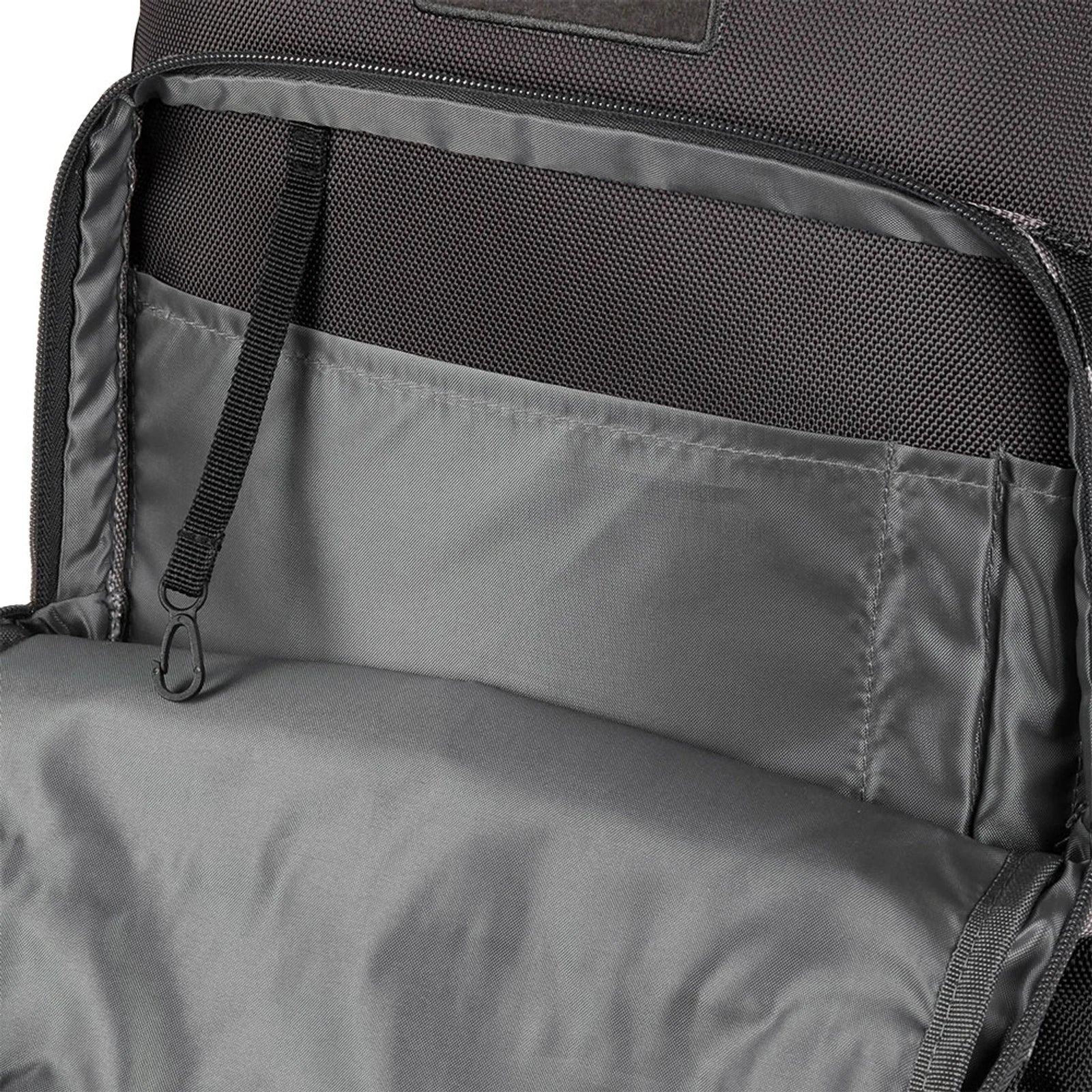 Open interior of a charcoal camo Cat Yuma A1 backpack showing internal mesh and slip pockets with a key clip.