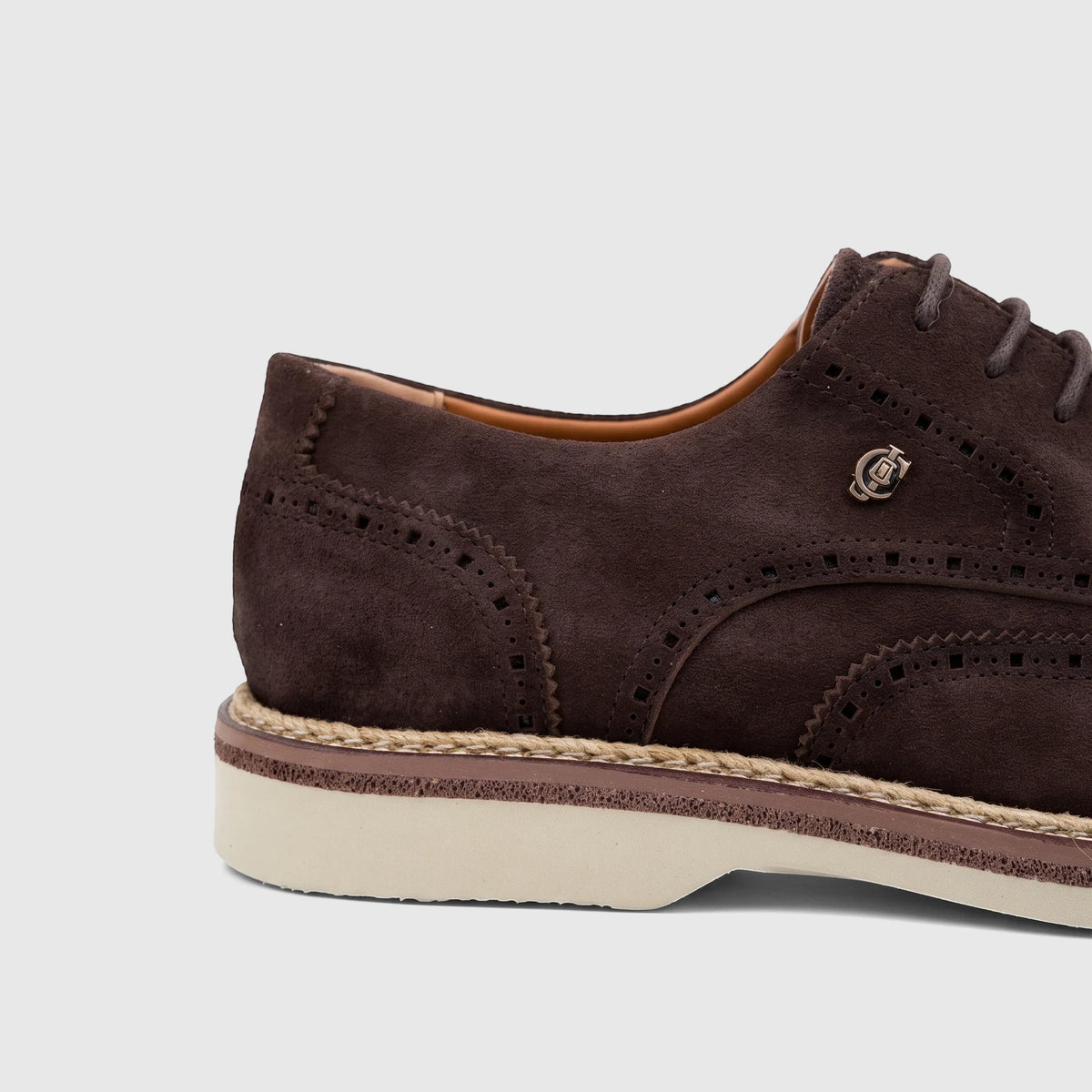 Men's brown suede lace-up brogue shoe from Crockett and Jones, featuring espadrille sole and side metallic logo.