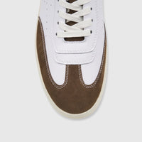 Close-up of a white and brown Crockett and Jones Men's Sneaker Roberto, featuring a white leather upper and brown suede toe