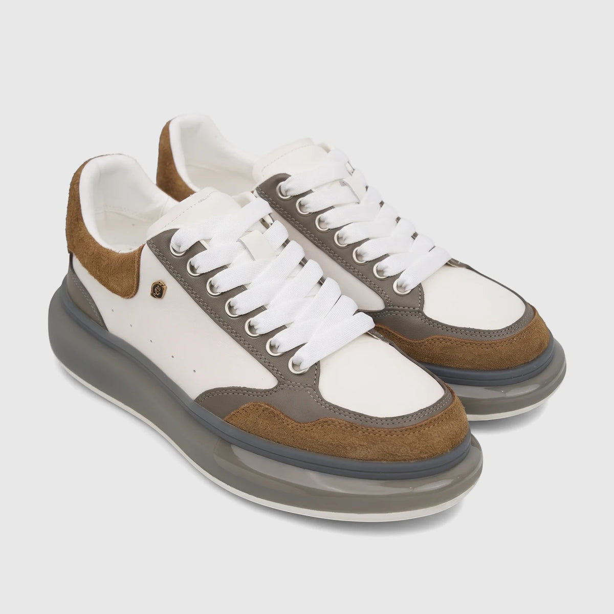 Pair of Crockett And Jones Men's Sneaker Tito 62.CGS548F in white, brown, and grey, featuring chunky soles and white laces.