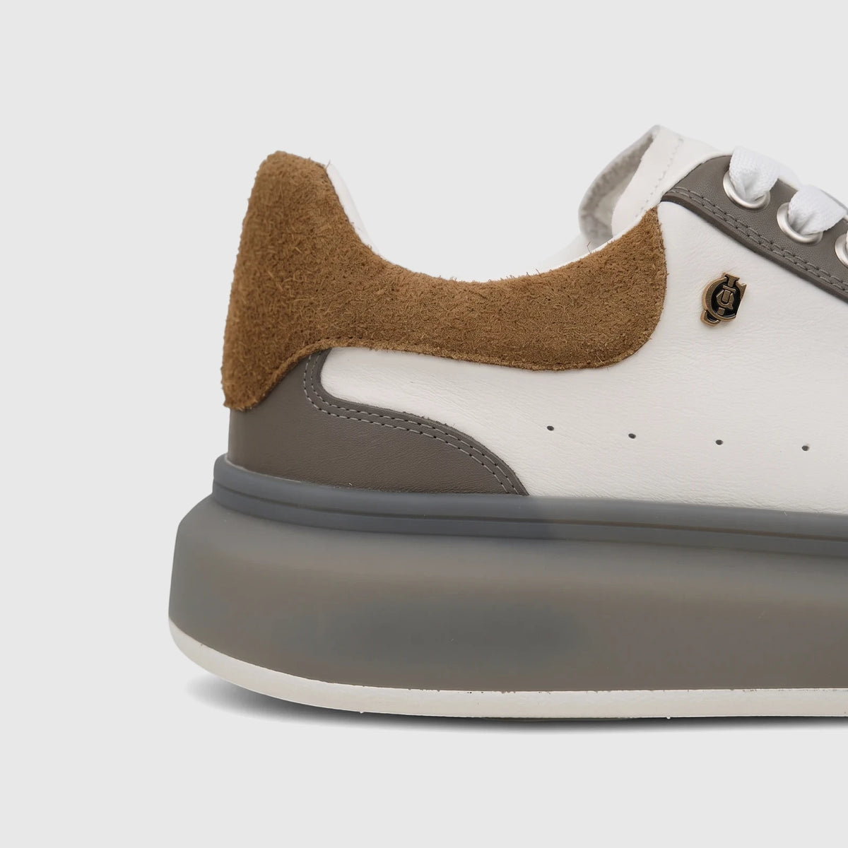 Close-up side view of Crockett And Jones Men's Sneaker Tito in white and coffee brown with a thick grey sole.