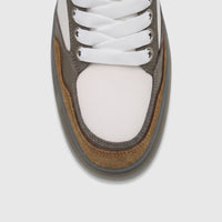 Close-up top-down view of a men's Crockett And Jones Tito sneaker, featuring white leather, coffee brown suede, and grey