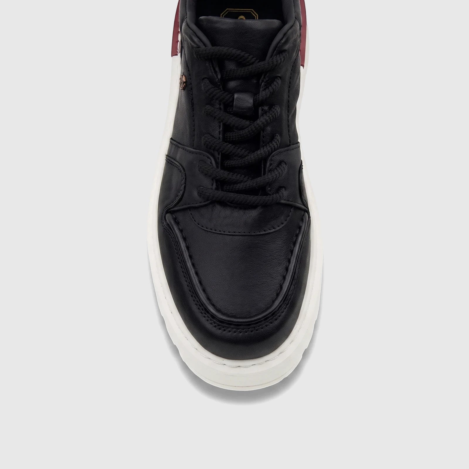 Front view of a Crockett and Jones Men's Tino 62 black leather sneaker with a white sole and black laces.