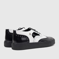Crockett and Jones Men's Alonzo black and white leather lace-up brogue shoes with a thick black sole, side view.