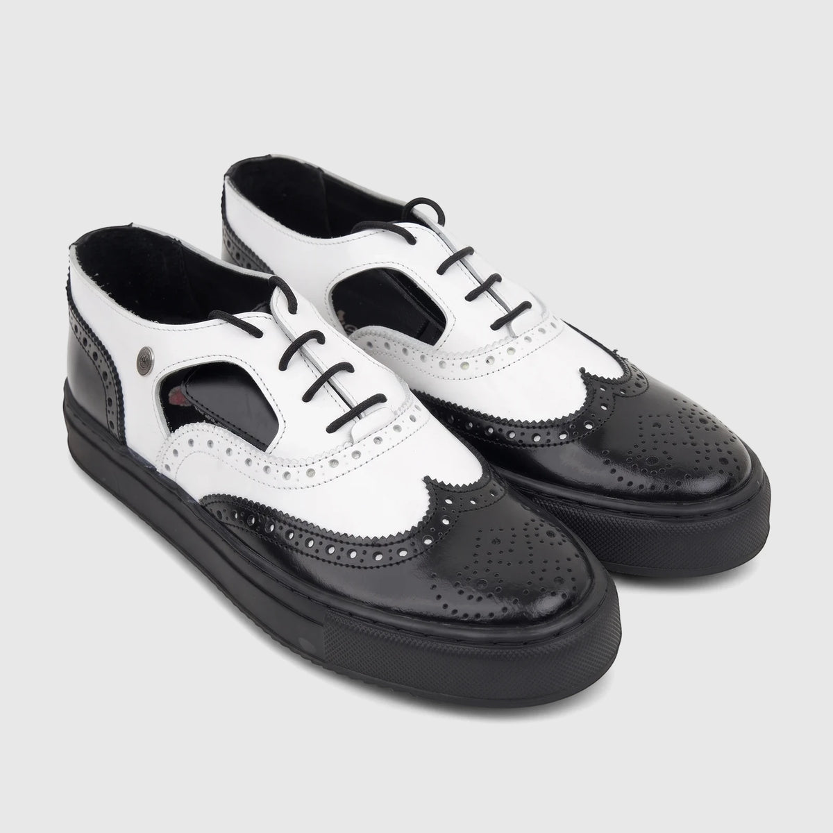 Crockett and Jones Men's Lace Up Brogue Alonzo shoes. Stylish black and white leather wingtips with thick soles.