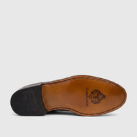Sole view of a black Crockett & Jones Men's Jason dress lace-up shoe, featuring a brown leather sole and black heel with