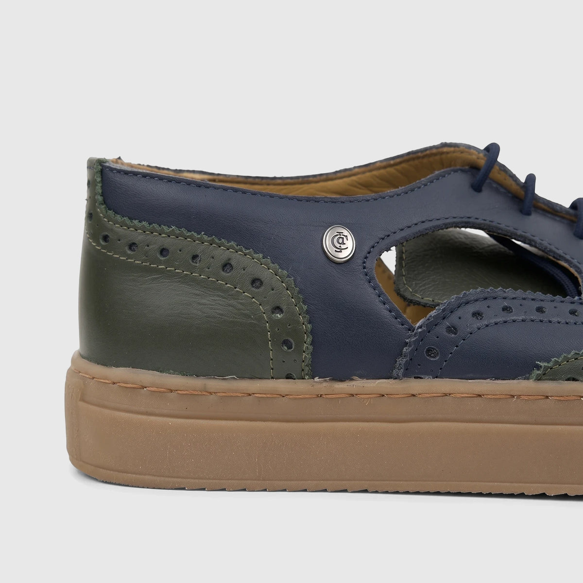Crockett and Jones Men's Lace Up Brogue Alonzo shoe in navy and olive green leather with brogue detailing.