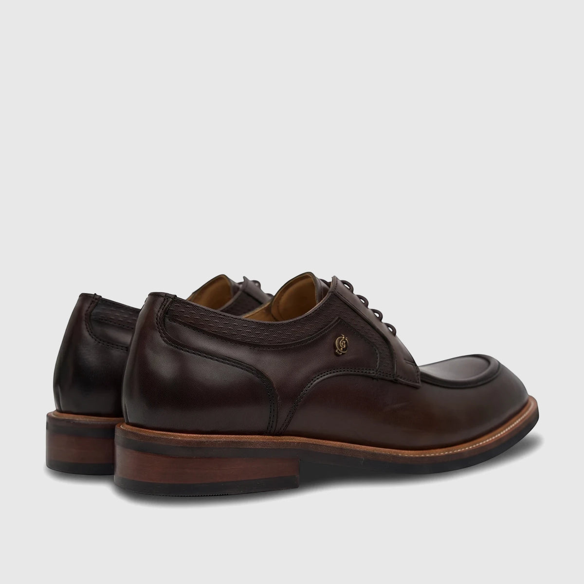 Dark brown leather Crockett And Jones Men's Lace Up Guilio dress shoes, captured from a rear-quarter side view.