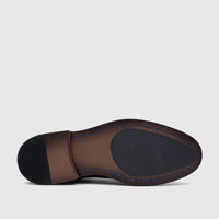Bottom view of a Crockett And Jones Men's Lace Up Guilio shoe, featuring a brown leather sole with black rubber heel and