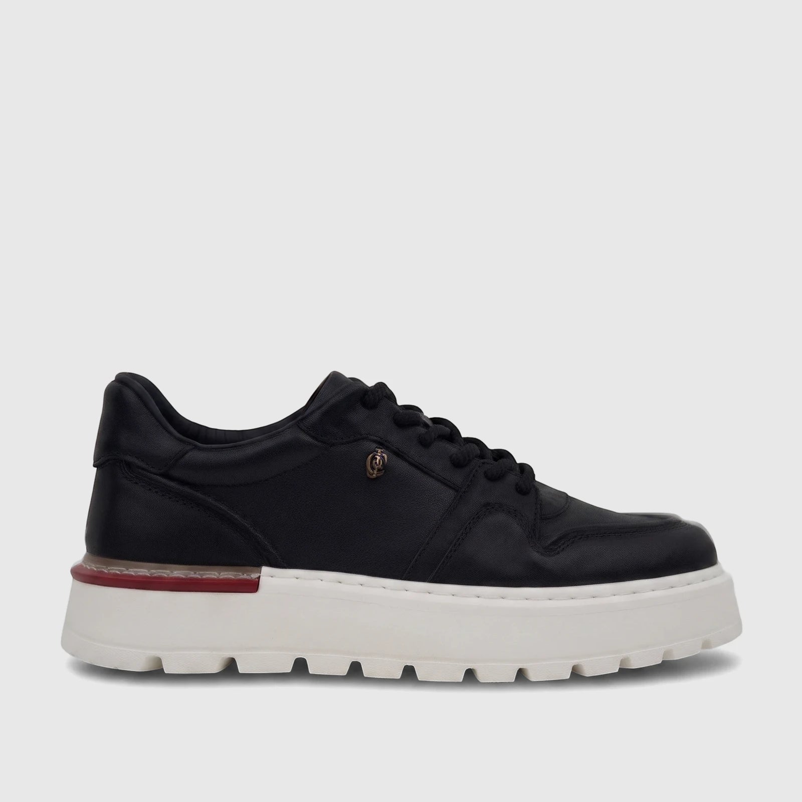 Black leather Crockett and Jones Men's Sneaker Tino with white platform sole and red accent, side view.