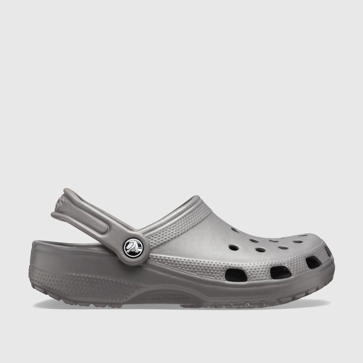 Side view of a single Crocs Classic 10001-0DA Slate Grey clog, featuring classic shape, ventilation ports, and a pivoting