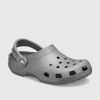 Slate grey Crocs Classic clogs, shown from a slightly elevated side view, highlighting the textured design and signature