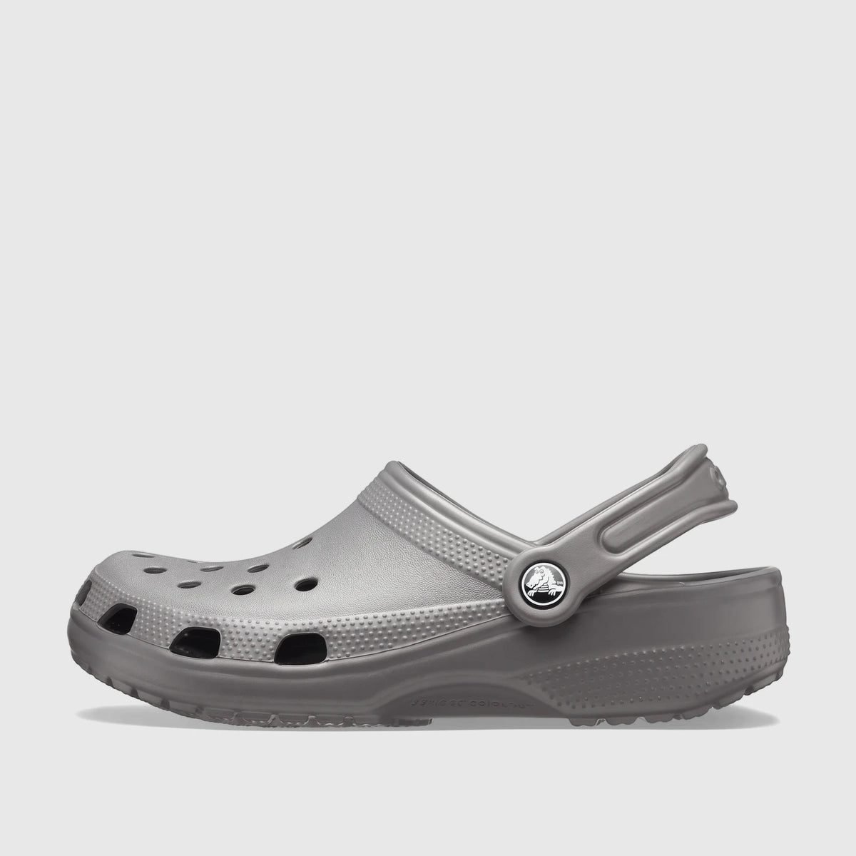 Crocs Classic clog shoe in slate grey, shown from the side, featuring ventilation ports and a movable heel strap.