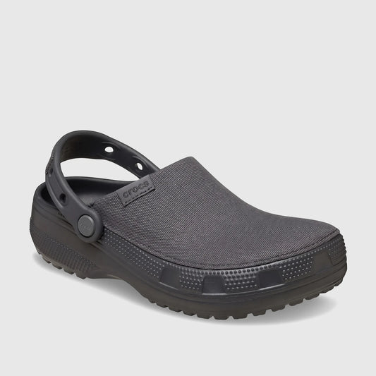 A black Crocs Classic Crafted Clog, model 211354-0LD, shown from a side view. Features include its durable construction and