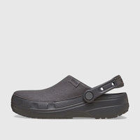 Dark gray Crocs Classic Crafted Clog from a side view, featuring a textured upper and movable heel strap for comfort and