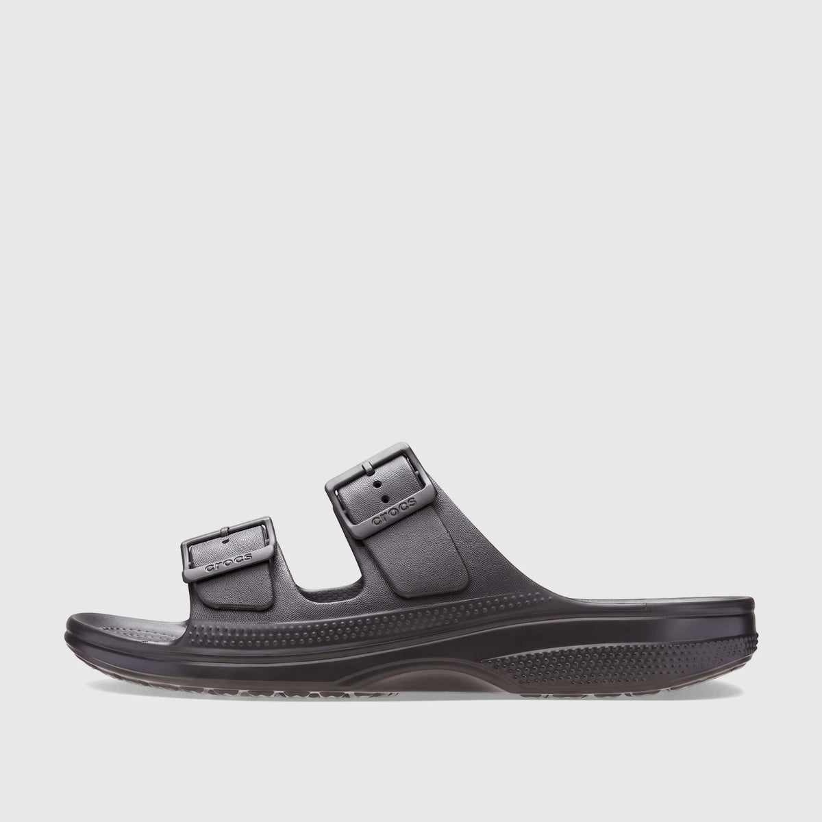 Black Crocs Saturday Sandal, side view, made from molded material with two adjustable buckle straps.