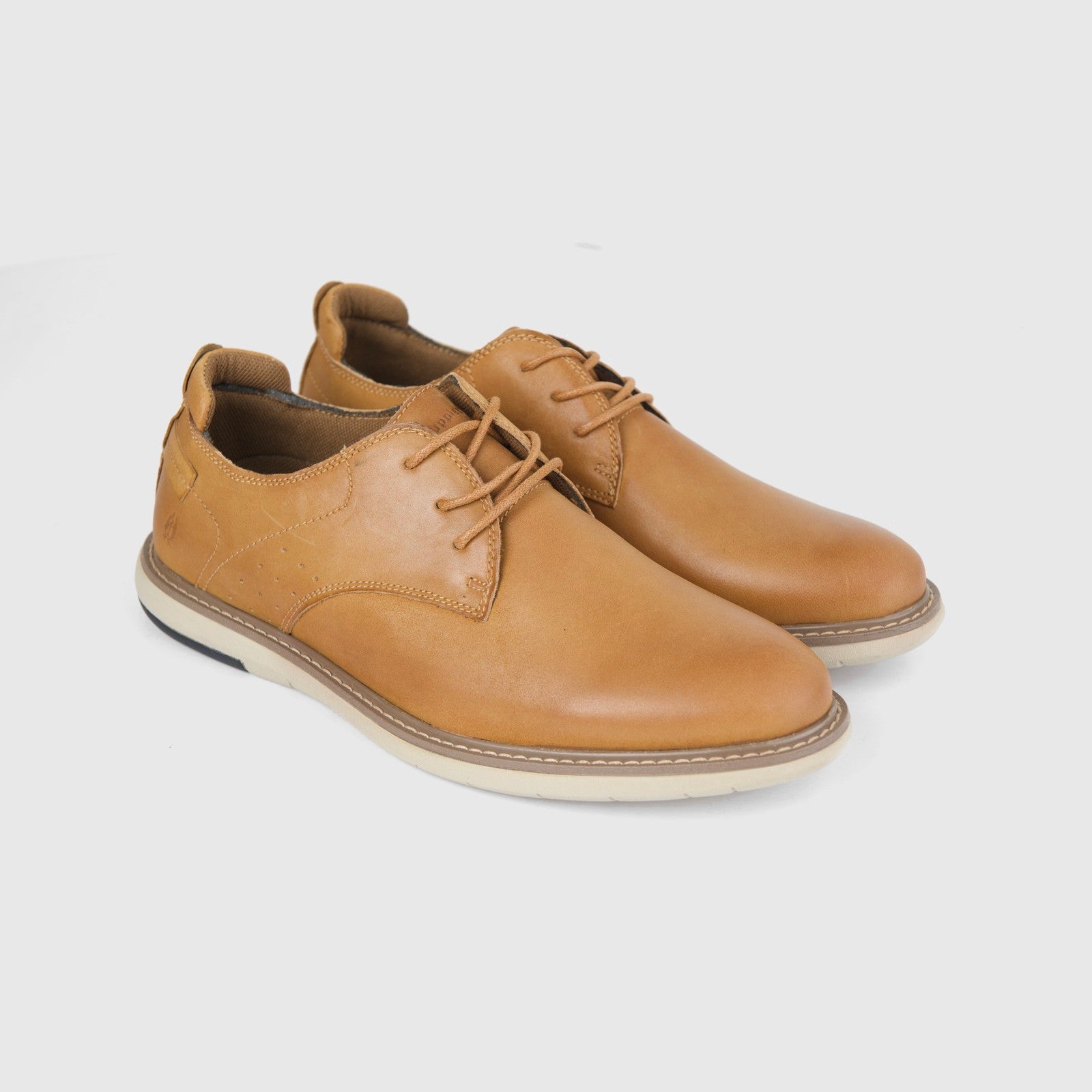 Hush Puppies Men's Casual Lace Up Dylan HPM00676 shoes in tan leather, pair shown at side angle with laces