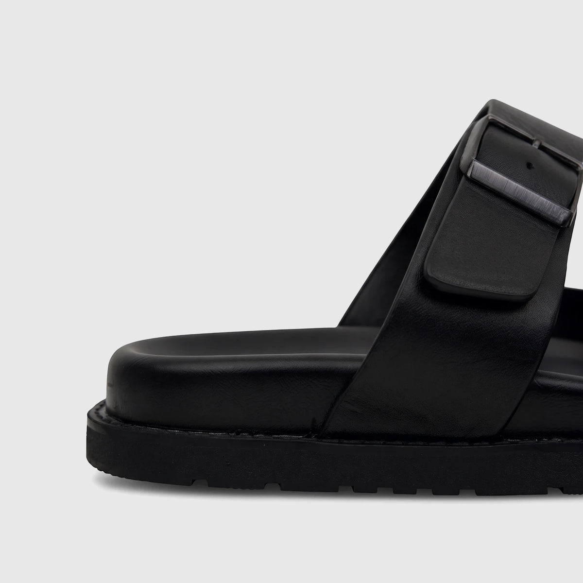 Fabino Men's Black Leather Comfort Sandal M3220238, shown in a close-up side profile view with a matte buckle.