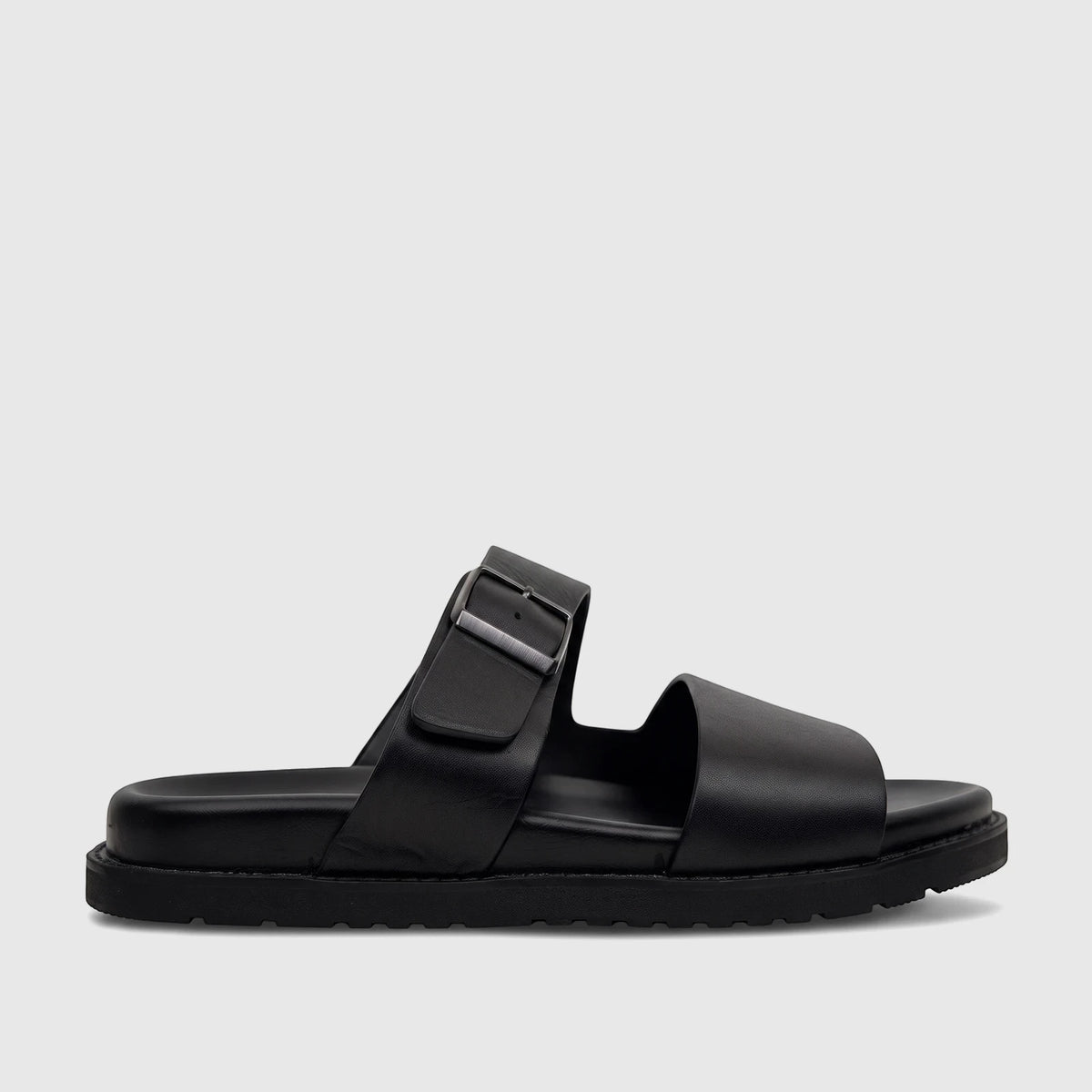 Black leather men's comfort sandal with two wide straps, an adjustable buckle, and a chunky sole, shown in profile view.