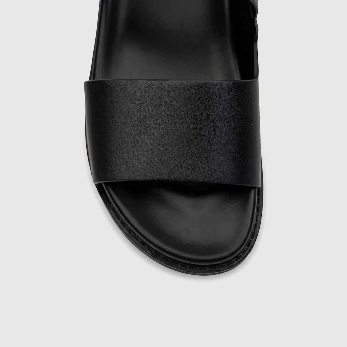Close-up front view of a black Fabino Men's Leather Comfort Sandal, showcasing the wide strap and comfortable footbed.