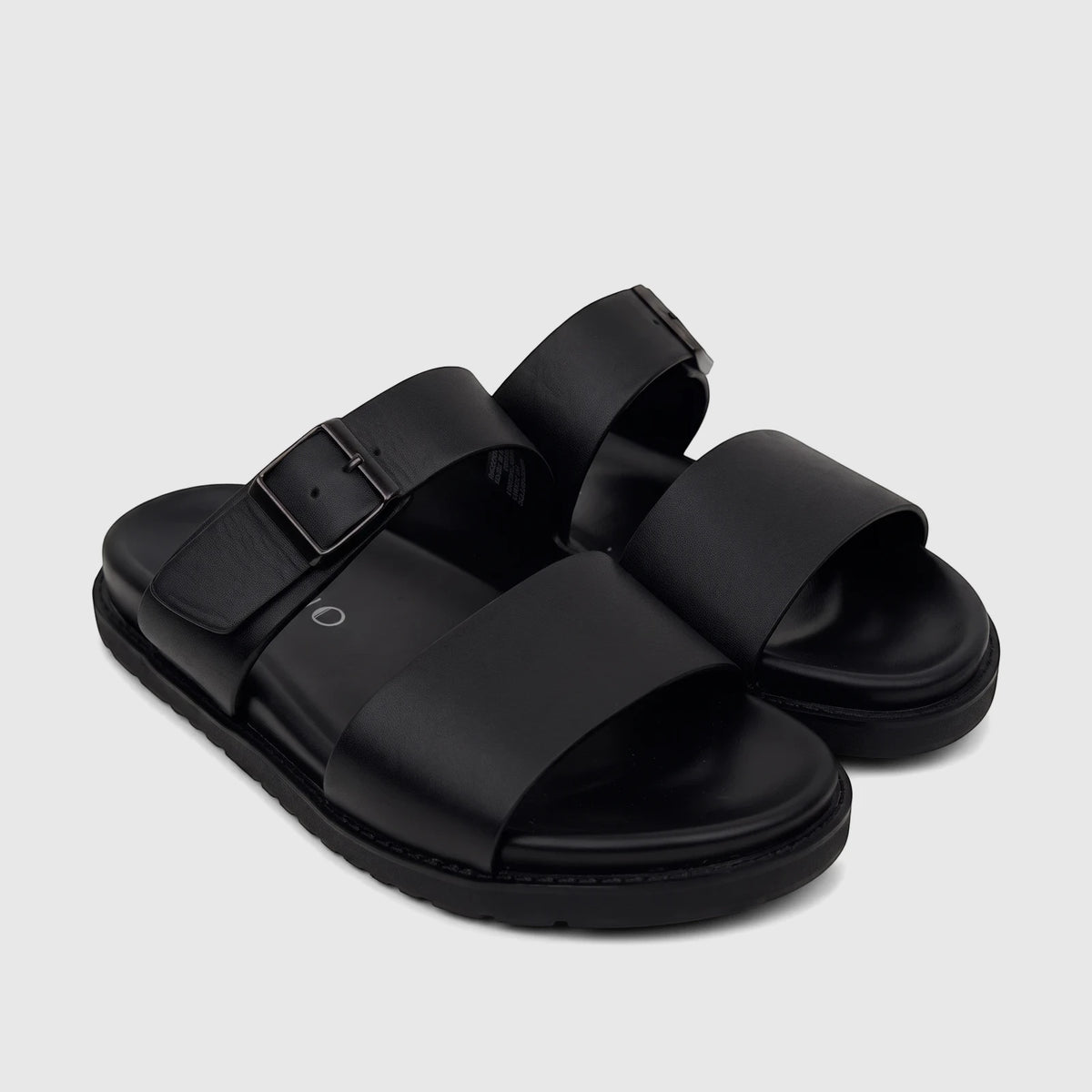 A pair of black leather Fabino men's comfort sandals with wide straps and buckles, photographed from an elevated angle.