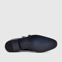 Black men's Fabino leather double monk shoe, showing the dark blue sole with brand details and textured heel.