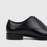 Close-up side view of a black leather men's Fabino M3220205 lace-up dress shoe with intricate brogue detailing.