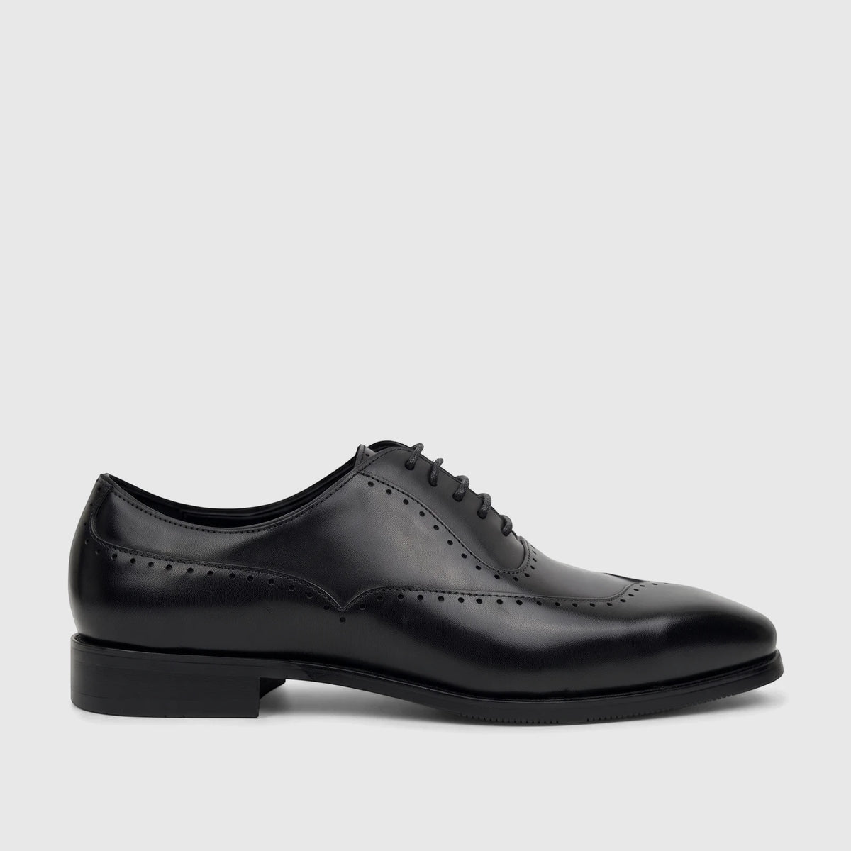 Fabino Men's black leather lace-up dress shoe, M3220205, with brogue detailing and a polished finish, presented in a side
