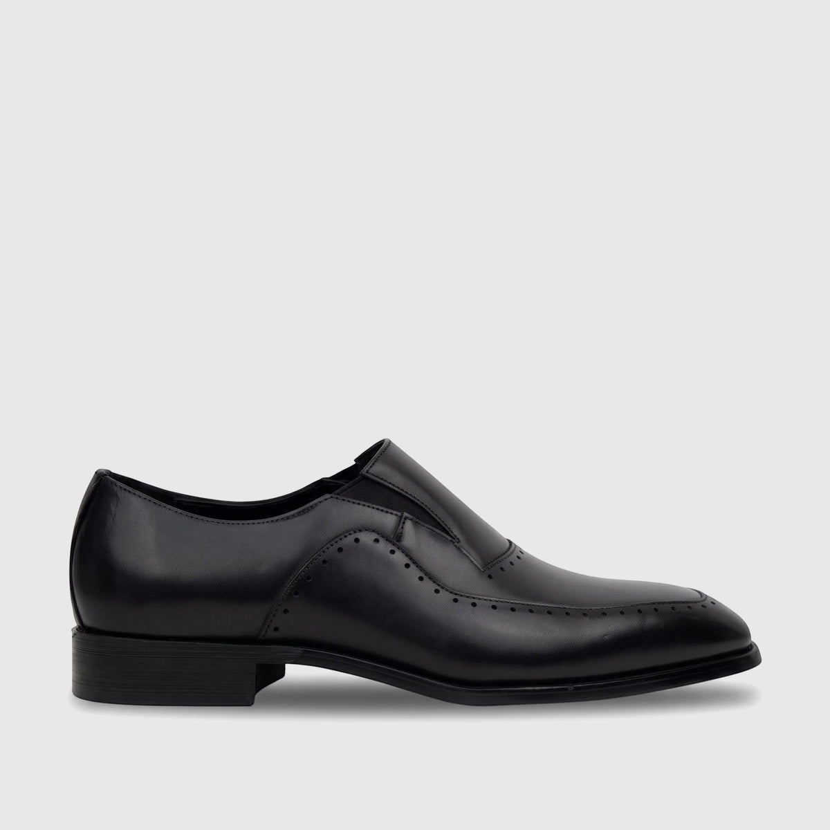 A men's black leather slip-on dress shoe, side view, featuring elegant brogue detailing and a polished finish.