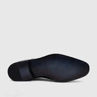 Fabino Men's black leather slip-on dress shoe, viewed from below, showcasing the sole with brand details and heel texture.