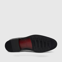 Underside view of a Fabino Men's Black Patent Leather Dress Lace Up Shoe M3220208, showing the textured black sole and red