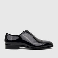 Fabino men's black patent leather lace-up dress shoe, visible in a side profile view, showcasing its glossy finish and cap