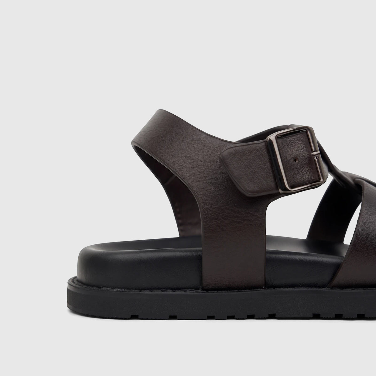 Brown Fabino Men's Leather Comfort Sandal, showcasing its textured leather upper, chunky black sole, and silver buckle. Side