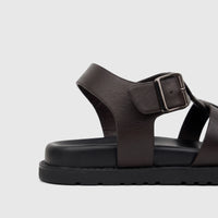 Brown Fabino Men's Leather Comfort Sandal, showcasing its textured leather upper, chunky black sole, and silver buckle. Side
