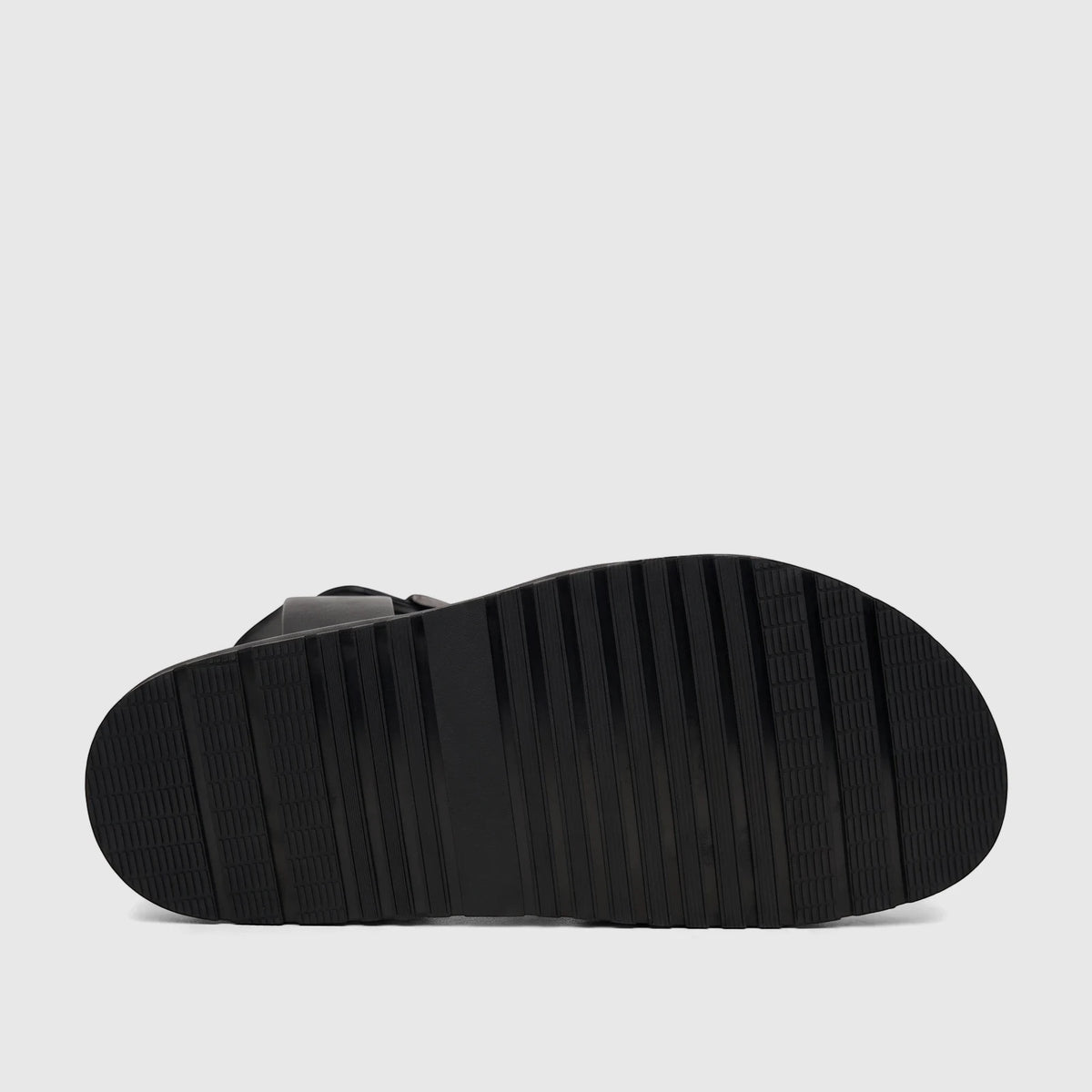 Underside view of a black Fabino men's leather comfort sandal, showcasing its durable ribbed sole pattern.