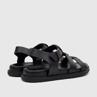 A pair of black Fabino men's leather comfort sandals with a strappy design and buckle closure, presented on a white surface.