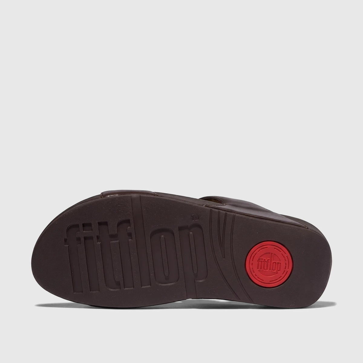 Fit Flop Ladies Comfort Sandal Lulu Crystal Embellished Slide in chocolate brown. Bottom view showing the sole with embossed