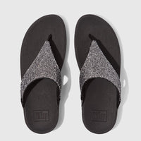 Pair of Fit Flop Ladies Comfort Sandals, Lulu Glitterball style, featuring silver glitter straps and black ergonomic soles,