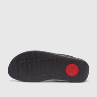 Underside view of a black Fit Flop Ladies Comfort Sandal Lulu Glitterball sole, featuring its textured surface and a red