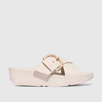 Fit Flop Ladies Comfort Sandal Lulu Resin Buckle Leather Cross Slide, cream, side view, with a gold-toned buckle and