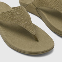 Close-up of two deep olive Fit Flop Ladies Comfort Sandal Lulu Shimmerglitz, featuring woven textured straps and comfortable